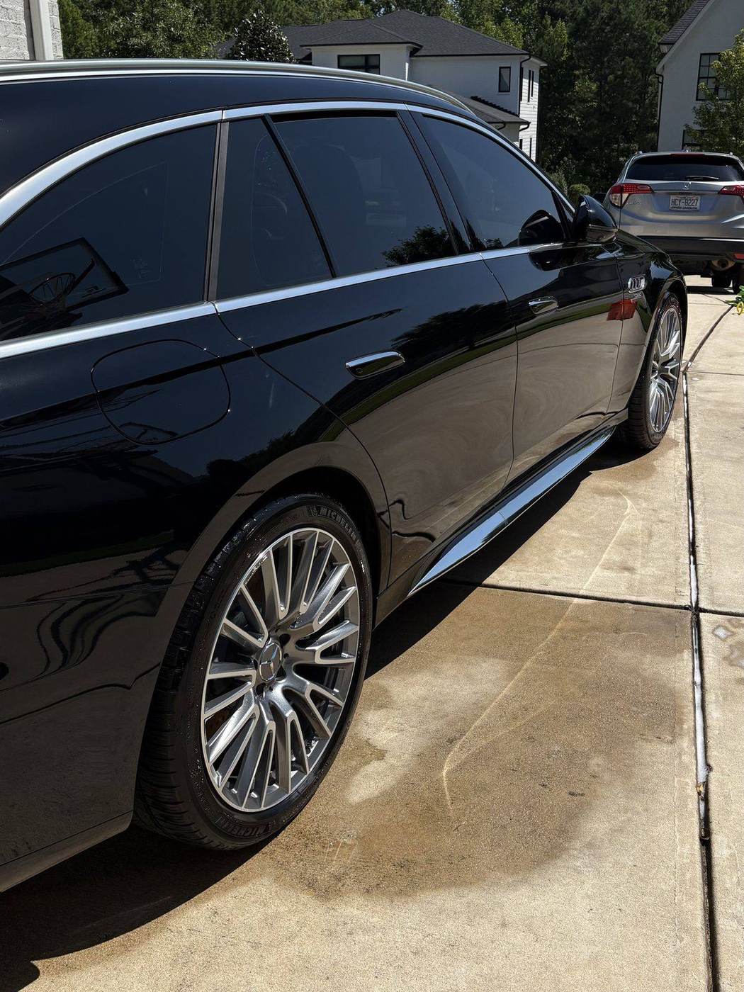 Mirror gloss finish on a black Mercedes wagon