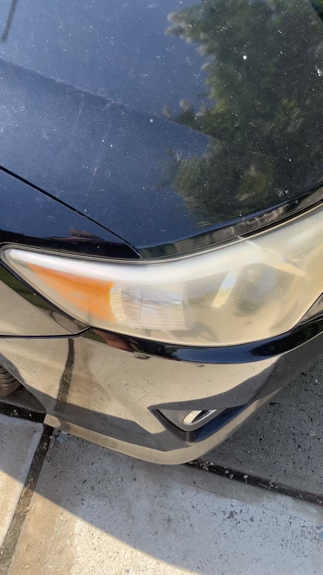 Foggy yellowed headlight before restoration